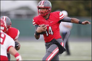 Toledo Central Catholic player DeShone Kiser, 14,  scores a 54 yard touchdown run during the second quarter at Gallagher Stadium in Toledo on Friday.