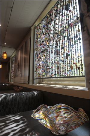 The Toledo Museum of Art cafe's bead curtains provide visitors with thousands of tiny pieces of artwork to peruse, each made by a different area artist.