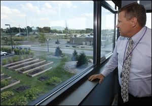 Municipal Judge Kim Hoover assigns nonviolent offenders to work in a garden outside the courthouse. This year, plants were started in the courthouse basement under lights seized from a marijuana grower.