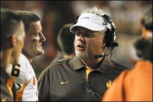 Wyoming coach Dave Christensen, right, nearly hired Toledo coach Matt Campbell as an assistant coach in December, 2008.