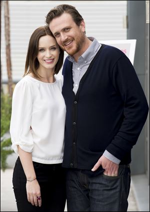 Actors Emily Blunt, left, and Jason Segel pose at a promotional event for upcoming cinema release 