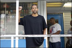 Terrence Threadill, who works at Clark gas station at Dorr and Hoag streets, says the Toledo police camera near the station is an added measure of security.