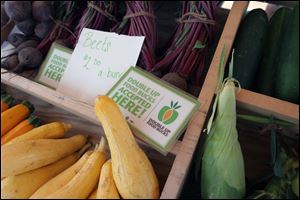 The 'double-up bucks' program doubles the purchasing power of food stamp customers up to $20. Shoppers using food stamps have spent about $2,000 at the three market sites so far this summer. 