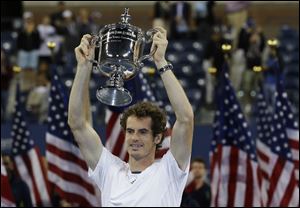 Britain's Andy Murray poses with the trophy after beating Serbia's Novak Djokovic in the championship match at the 2012 US Open tennis tournament.