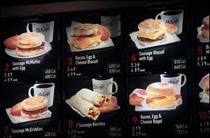 Items on the breakfast menu, including the calories, are posted at a McDonald's restaurant in New York.
