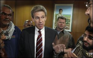 U.S. envoy Chris Stevens speaks to local media at the Tibesty Hotel where an African Union delegation was meeting with opposition leaders in Benghazi, Libya.