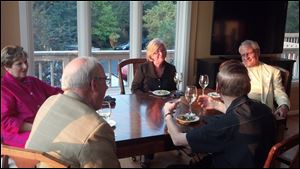 Chaine members and guests enjoy each other's company, fine wine, and gourmet food at the River House Inn in Perrysburg