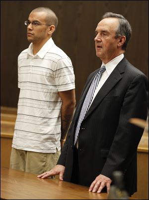 Lucas County Dog Warden’s employee Aaron Nova, left, is with attorney Jerome Phillips.
