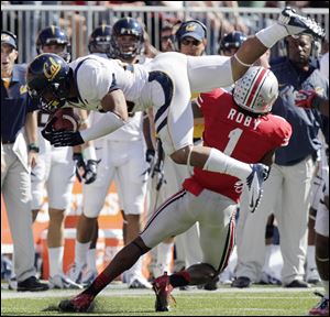 California’s Isi Sofele is tackled by Ohio State’s Bradley Roby during the fourth quarter. The Buckeye defense struggled most of the day, surrendering 512 yards of offense to the Golden Bears, but they did have six sacks and an interception to clinch the victory.