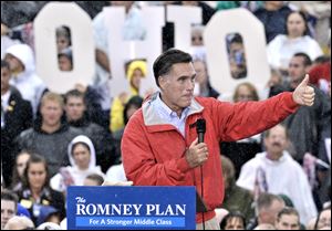 Republican presidential candidate, former Massachusetts Gov. Mitt Romney campaigns FRIDAY in the rain at Lake Erie College in Painesville.