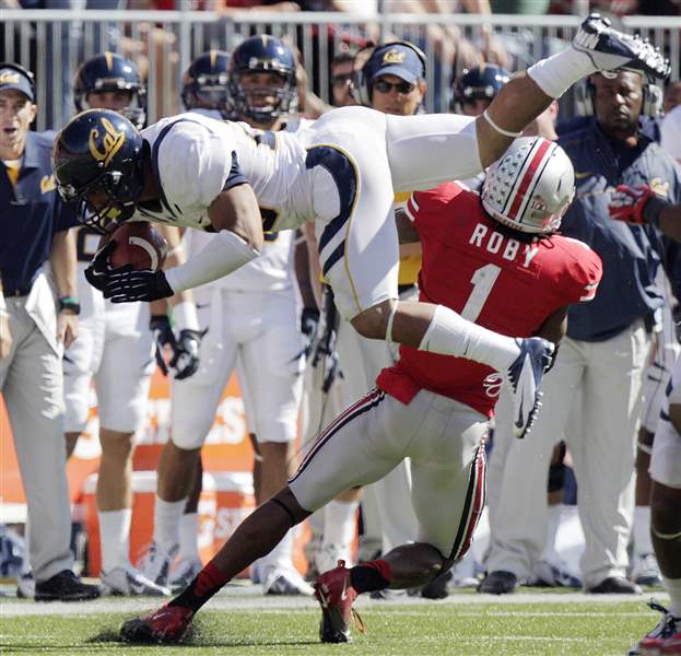 California-s-Isi-Sofele-is-tackled-by-Ohio-State-s-Bradley-Roby