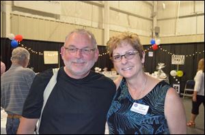 Frank Booth and Gale Tedhams at the Dealin' for Dogs event to help the assistance dog program.