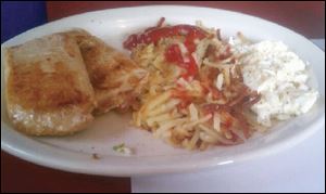 Egg whites, pork chops and potatoes breakfast combo.