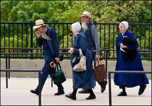 Members of the Amish community enter the U.S. Federal Courthouse in Cleveland.