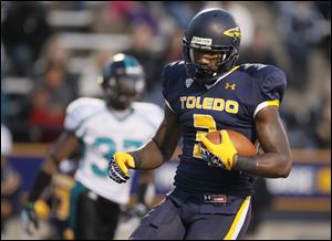 University of Toledo receiver Cordale Scott gets into the end zone for a touchdown during the first quarter Saturday against  Coastal Carolina at the Glass Bowl.