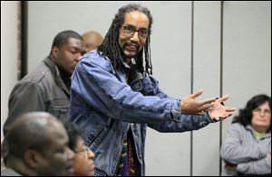 Leslie Robinson speaks during a community meeting.