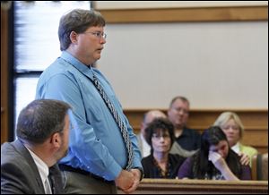 Former Portage Township firefighter Timothy Johnson addresses the court prior to being sentenced in Ottawa County Common Pleas Court, in Port Clinton.