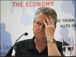 CAW National President Ken Lewenza listens to a question at a Canadian Auto Workers' news conference to announce the union has reached a tentative agreement with Chrysler, signaling a successful culmination of labor negotiations at all Big Three automakers without resorting to a strike.