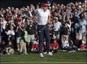 USA's Keegan Bradley reacts after nearly making a long eagle putt on the 15th hole during a four-ball match Friday at the Ryder Cup PGA golf tournament at Medinah Country Club in Medinah, Ill.