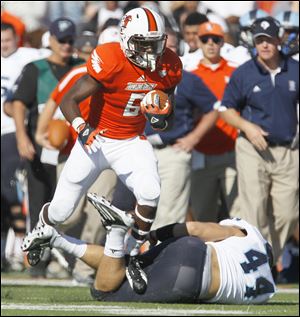 Bowling Green's Anthon Samuel steps over Rhode Island's Connor Caponegro. Samuel had 3 TDs.