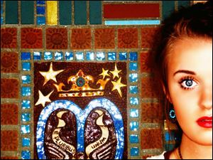 This photo was taken at Lourdes in front of one of their magnificent brick walls.
