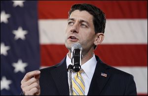 Republican vice-presidential candidate Paul Ryan speaks during a campaign rally in a Grand Aire hangar at Toledo Express Airport.