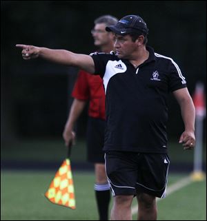 Perrysburg coach Jorge Diaz patrols the sidelines earlier this year.