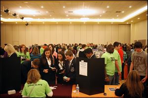 High School students make their way to each booth Tuesday during their playing of the life-size game of Life at the BGSU Student Union.