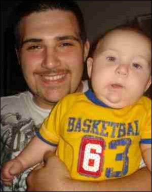 Jorge Duran, Jr., holding his son, Jorge Duran III. Duran shot and killed his son and ex-girlfriend, Amber Jones.