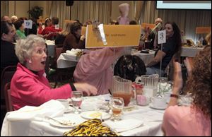 Fran Anderson and the other members of The Andersons’ team express excitement after learning they took first place at the bee.