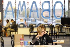 Volunteer Jennifer Berezna phone banks for President Obama in the Elyria campaign office.