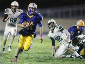 Northwood quarterback Nick Russell (11) runs the ball against Ottawa Hills.