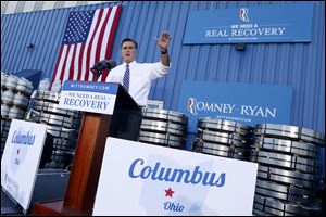 Republican presidential candidate, former Massachusetts Gov. Mitt Romney gestures while speaking at a campaign stop at Worthington Industries, a metal processing company, in Worthington, Ohio.