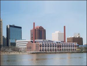 A Water Street Station artists rendering proposed project.  Seven months after announcing plans to transform the historic Toledo Edison steam plant into apartments, a YMCA, and health clinic, the project has encountered delays — but the developer said efforts are still moving forward.
