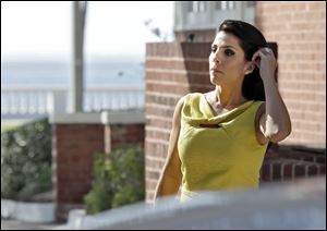 Jill Kelley is identified as the woman who allegedly received harassing emails from Gen. David Petraeus' paramour, Paula Broadwell. She serves as an unpaid social liaison to MacDill Air Force Base in Tampa, where the military's Central Command and Special Operations Command are located.