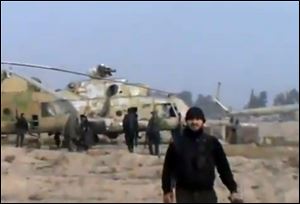 Syrian rebels capture a helicopter air base near the capital Damascus after fierce fighting in Syria.