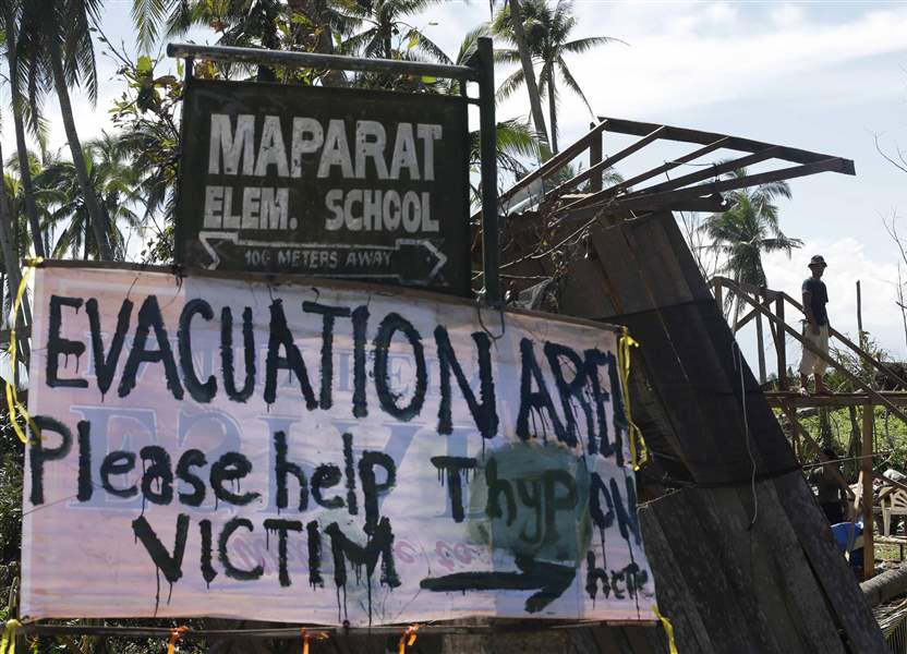 A-typhoon-victim-rebuilds-his-damaged-house