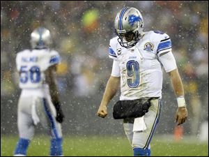 Detroit Lions quarterback Matthew Stafford walks off the field duringa 27-20 loss to the Packers on Sunday night in Green Bay, Wis. This was the third straight game they've blown a lead of 10-plus points, tying an NFL record shared by six other teams.