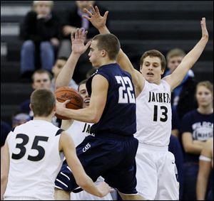 Perrysburg's Quinn Thomas, right, defends against Napoleon's Anson Lankenau in Thursday night's game.
