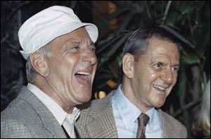 In a 1992 photo, Jack Klugman, left, and Tony Randall laugh at a news conference announcing that they will reprise their most famous roles as Oscar Madison and Felix Unger respectively, for a one-night benefit performance of Neil Simons play, 