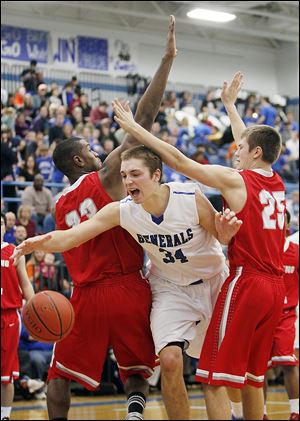 Anthony Wayne's Mark Donnal cuts between Bowling Green's Vito Brown, left, and Mitchell Gardner. Donnal finished with 14 points and 16 rebounds. Brown had 16 points and 10 rebounds.