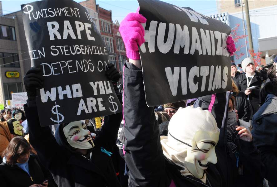 Steubenville-rally-masked-men