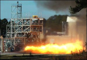 In this image taken from video, NASA engineers test fire a key part of a rocket engine left over from the 1960s-era Apollo moon missions on Thursday, in Huntsville, Ala. Engineers hope to gain valuable knowledge from the engine, which was originally supposed to power the Apollo 11 moon mission in 1969 but was grounded by a problem. 