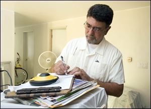 Certified general real estate appraiser Gilbert Valdez of Coast Appraisal Network evaluates a home in Fountain Valley, California. Realtors complain that they see inaccurate appraisals that are not keeping up with the changing housing market.