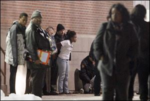 Fans leave the gym after a fight in Scott High School during the Scott v. Rogers basketball game Friday.