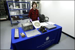 Curator Carlene Stephens shows some recordings by Thomas Edison, Alexander Graham Bell and Emile Berliner during a news conference at Smithsonian's National Museum of American History in Washington.