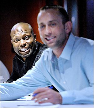 Torii Hunter, left, has been all smiles since signing with the Tigers this offseason.
