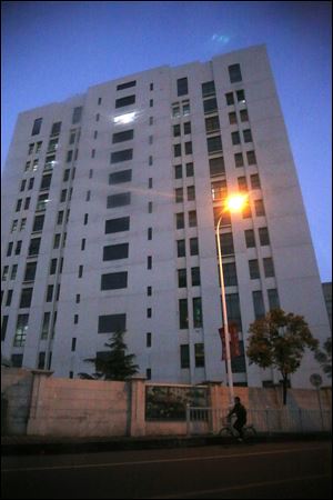The building housing “Unit 61398” of the People’s Liberation Army is seen in the outskirts of Shanghai. Cyberattacks that stole information from 141 targets in the U.S. and other countries have been traced to the Chinese military unit in the building, a U.S. security firm alleged today.