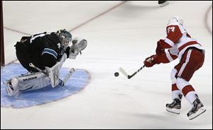 Detroit Red Wings center Damien Brunner (24) scored the lone goal against San Jose Sharks goalie Antti Niemi (31) in a shootout win Thursday night.