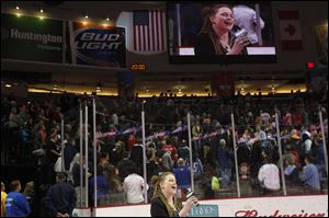 Crystal Bowersox sings the national anthem before the start of the Walleye game today in Toledo. The 'American Idol' contestant was cheered by thousands of hockey fans.